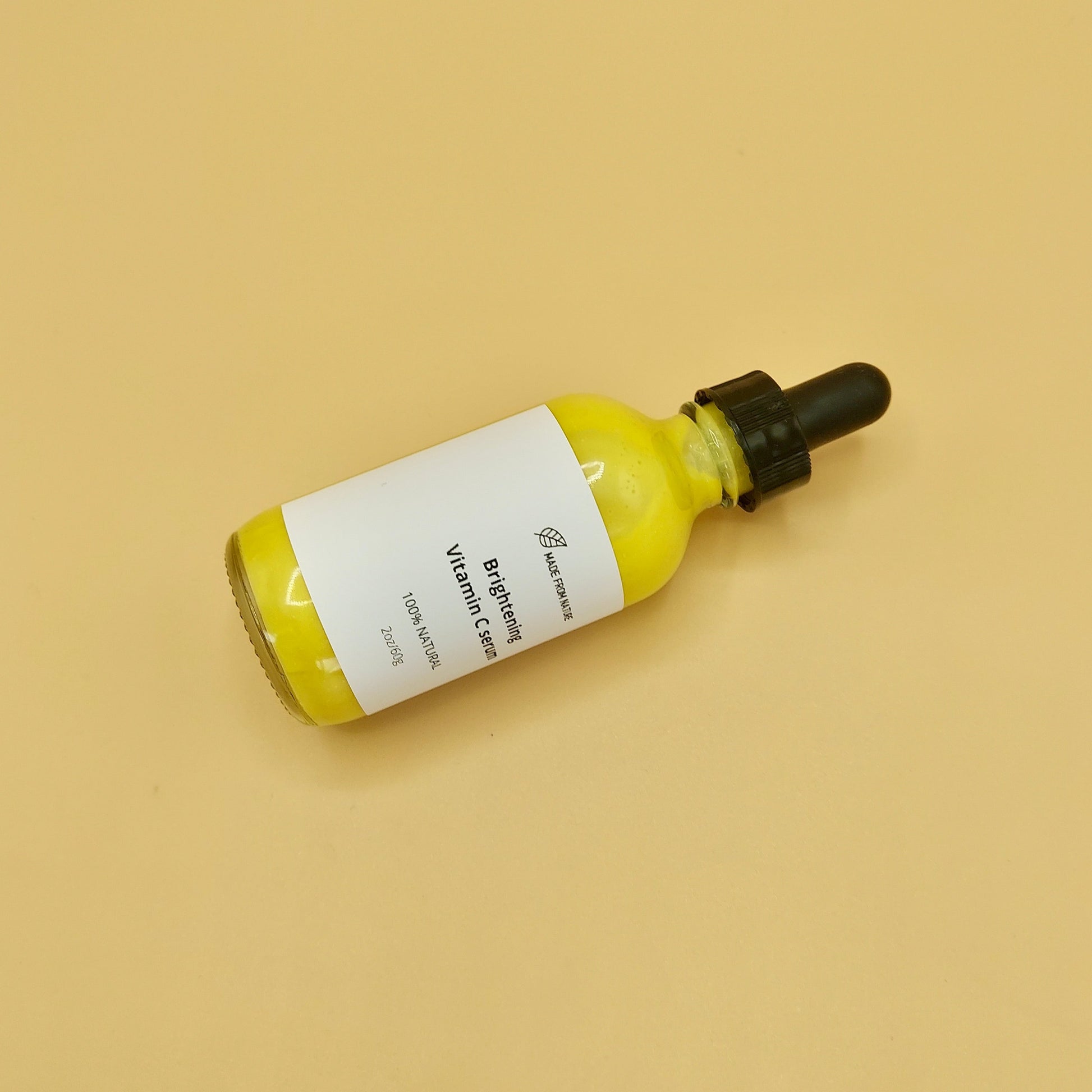 Natural Vitamin C serum is yellow colour in glass  Dropper Bottle. Skin Moisturizer for acne treatment and anti-aging serums for fine lines