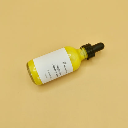 Natural Vitamin C serum is yellow colour in glass  Dropper Bottle. Skin Moisturizer for acne treatment and anti-aging serums for fine lines